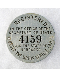 old Nebraska aluminum dashboard disc